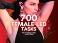 700 Female-led Tasks cover graphic with bold white title text and a dominant woman in black on a red background